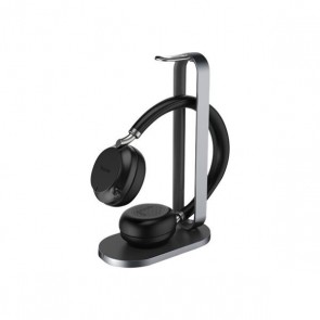 Yealink BH76 binaural Bluetooth ANC headset with Qi wireless charging stand.